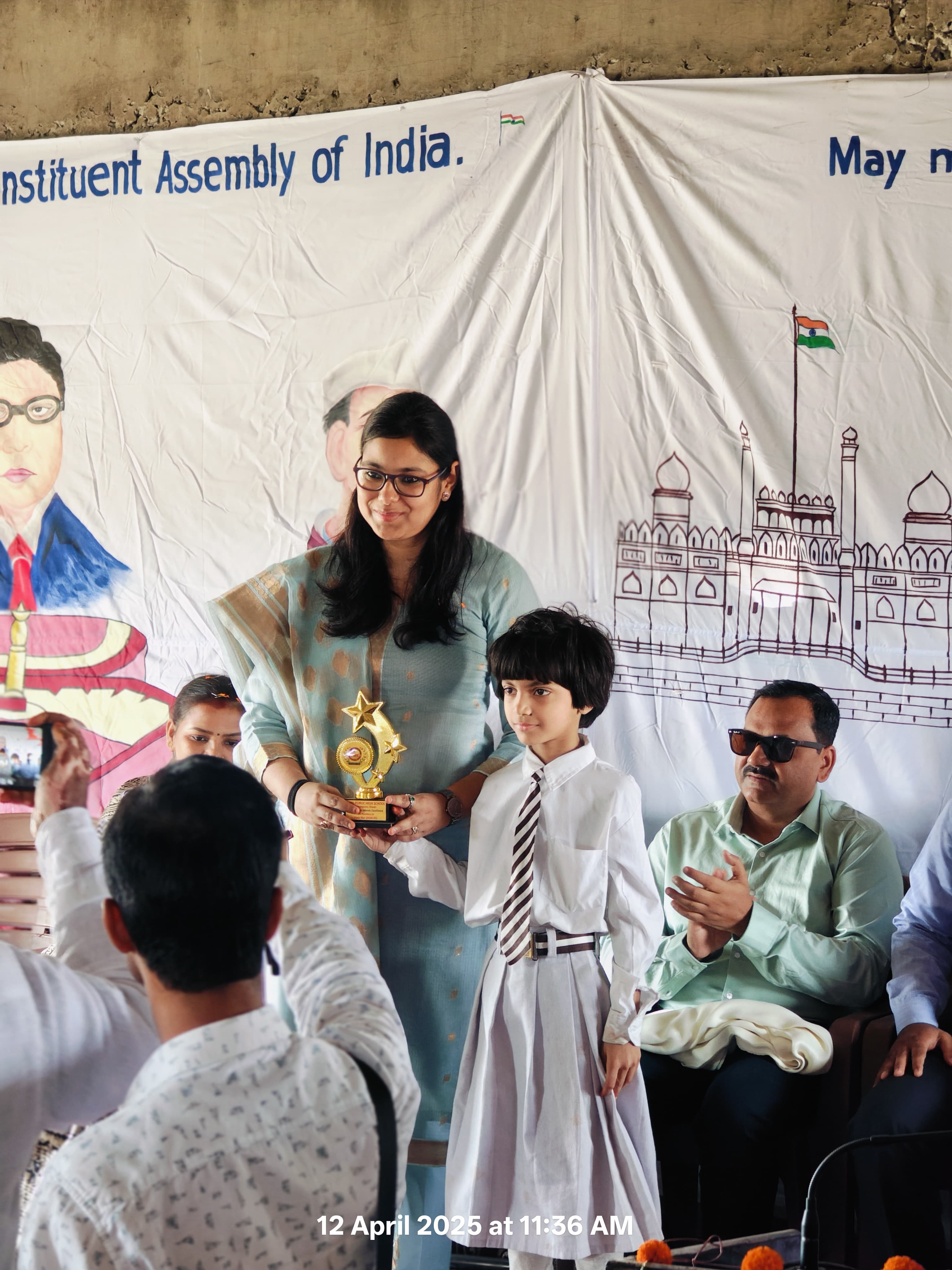 Students and staff at an award ceremony at Ideal Public School